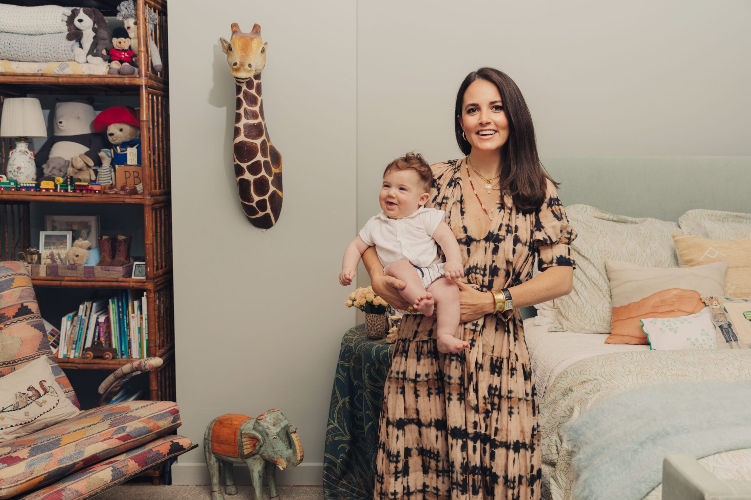 mother and baby in vintage-filled nursery
