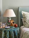 nightstand with turquoise tablecloth