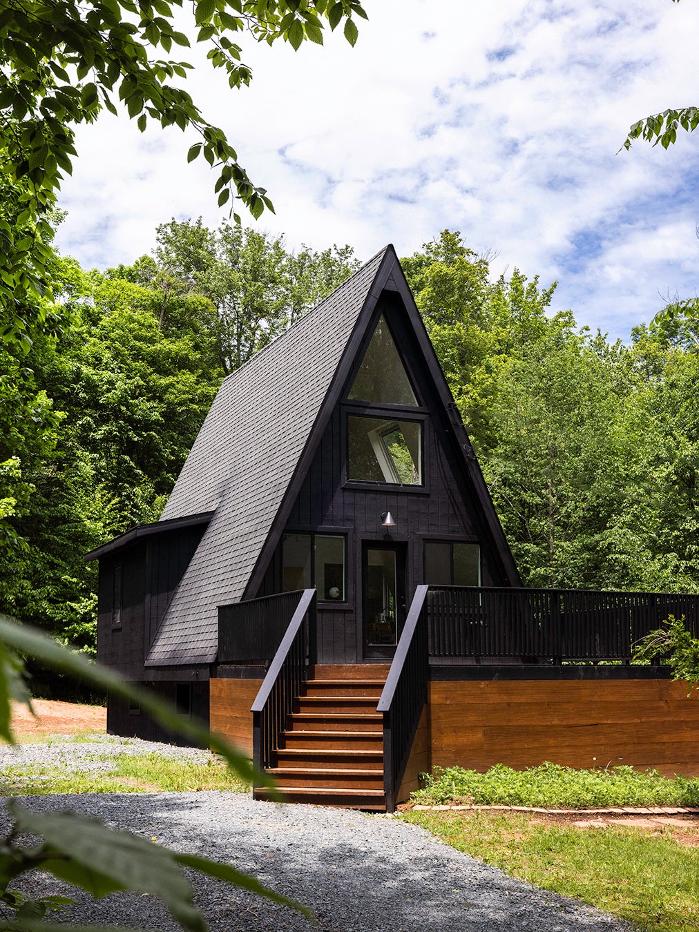 A-Frame Cabin With Large Front Deck Painted Black