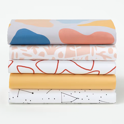 Colorful crib sheets by Tuft & Needle