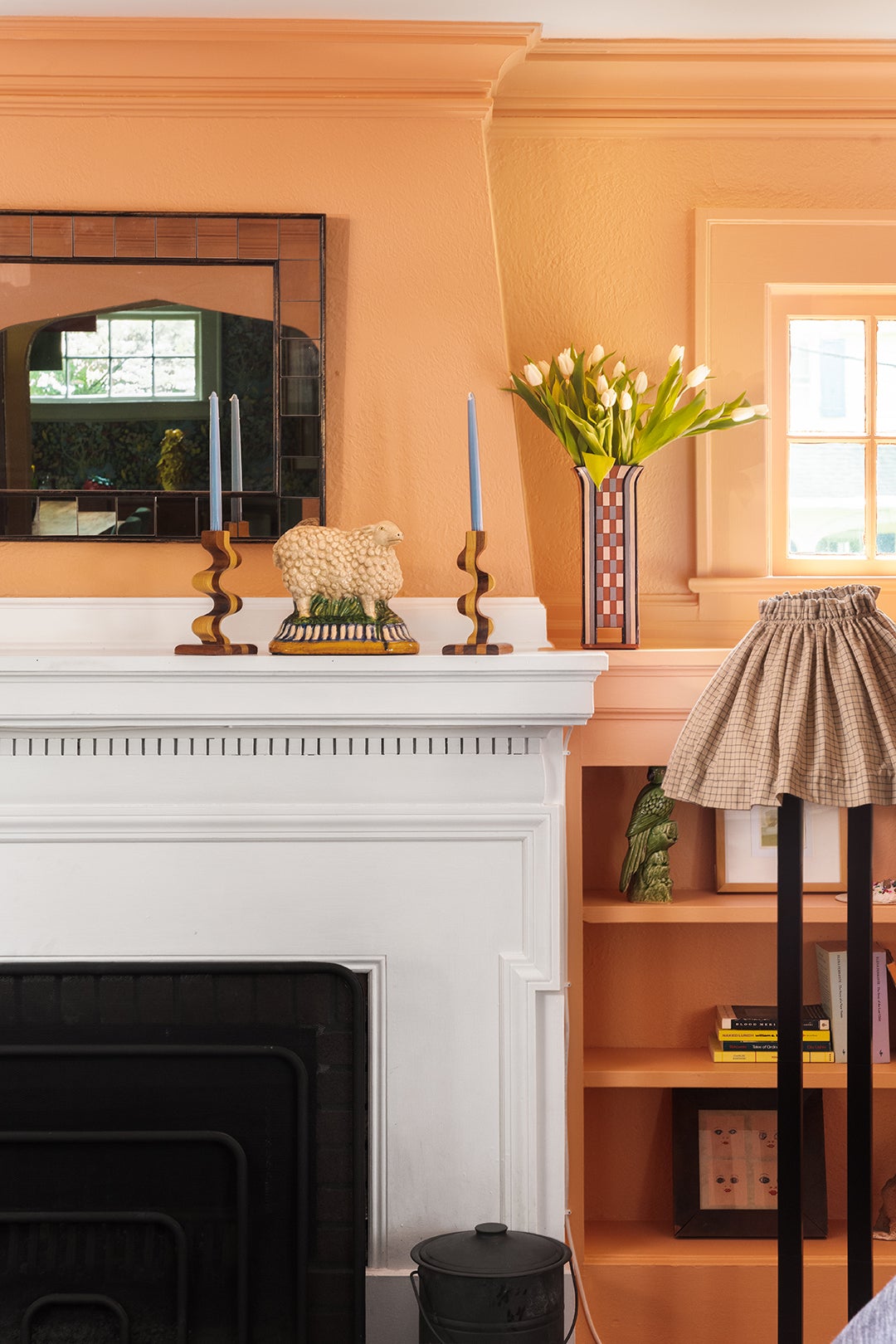 white fireplace in peach living room