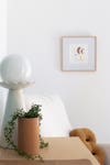 ceramic lamp and terracotta planter on table