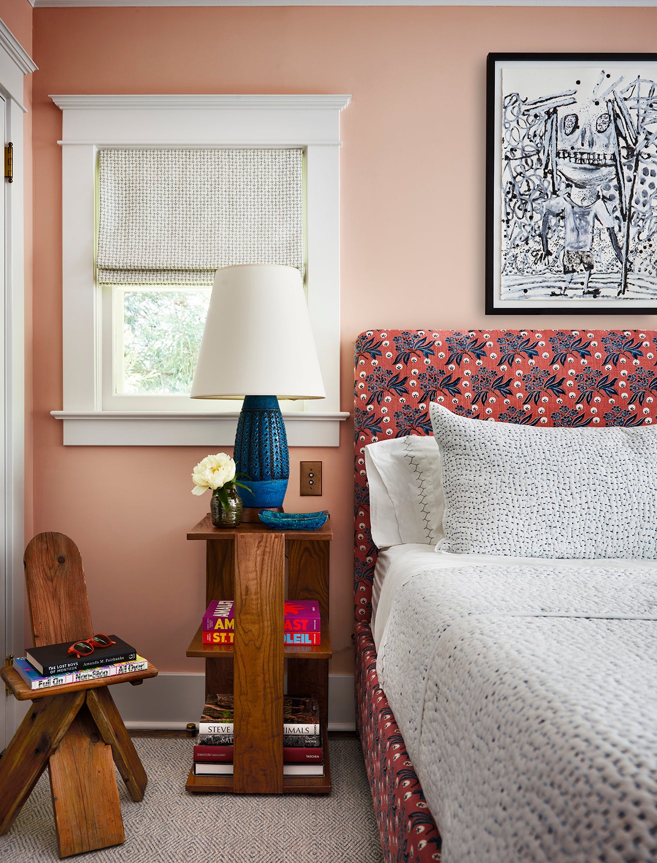 peach pink bedroom with rust patterned bed frame