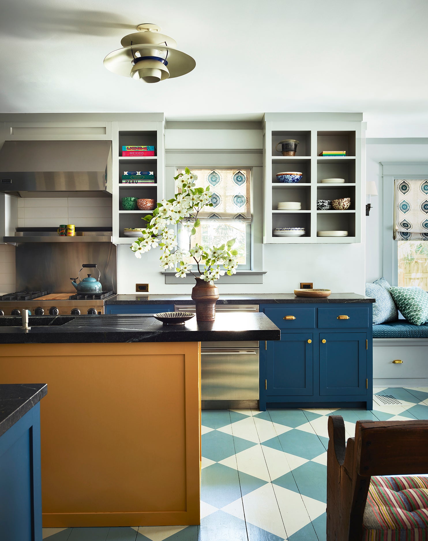 kitchen with navy cabinets and yellow island