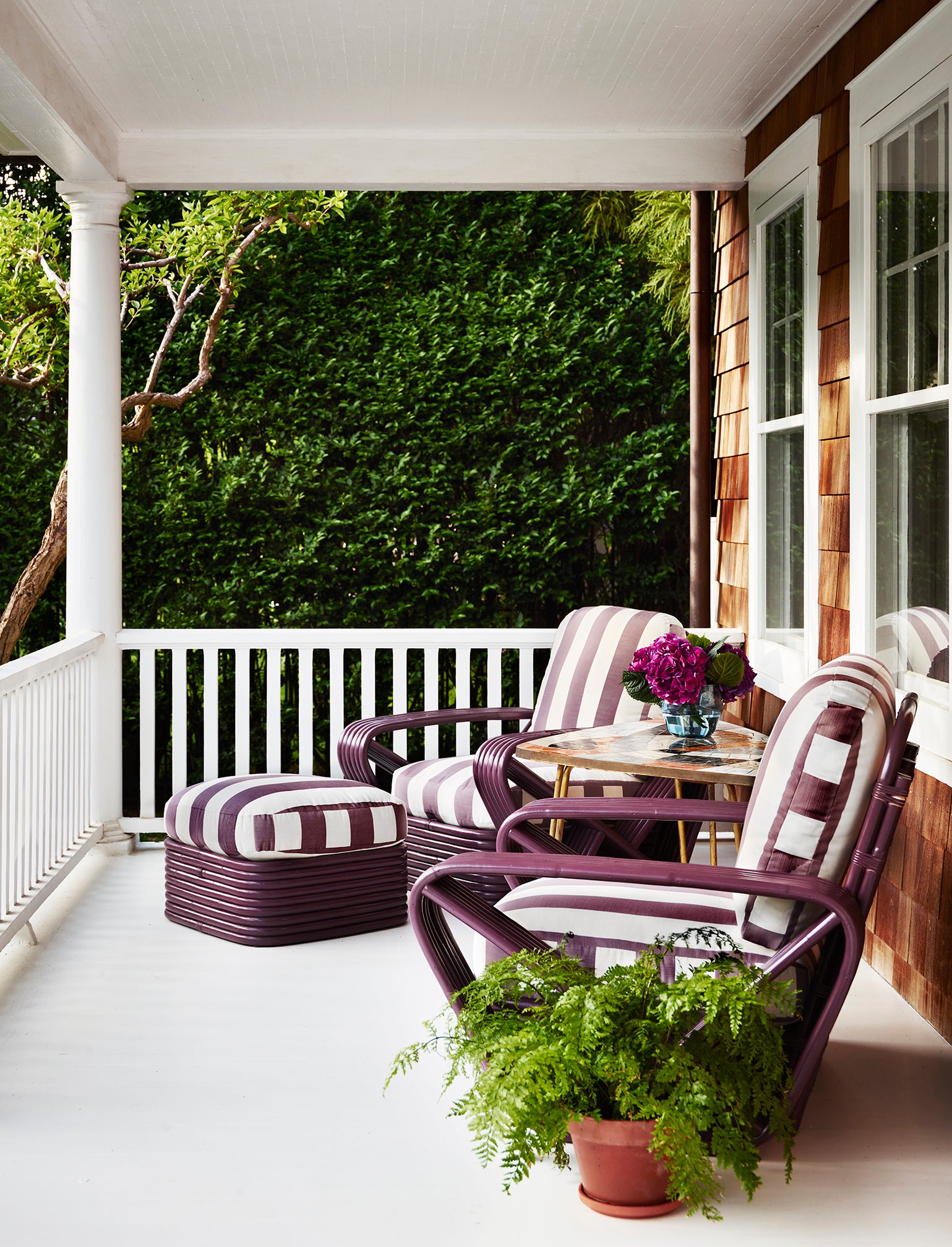 porch with eggplant striped armchairs