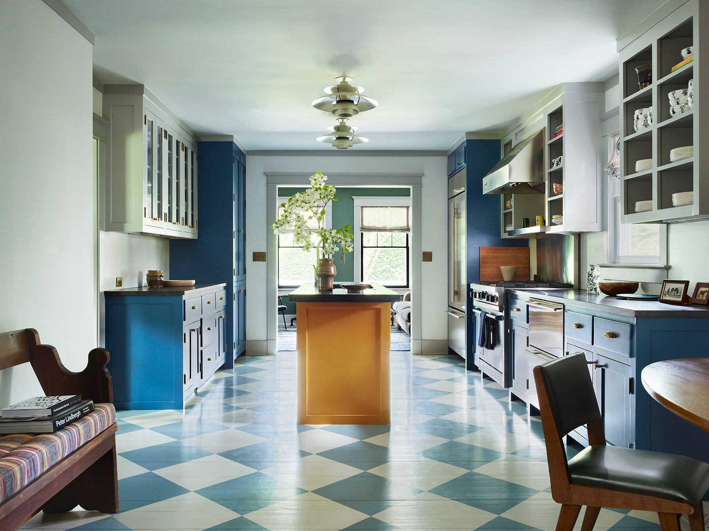 blue and yellow kitchen with checked floors