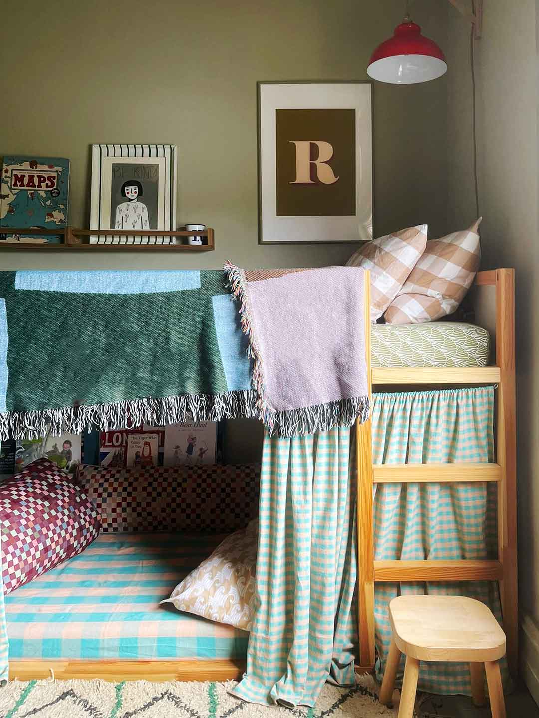 layered patterned textiles on kid's bunk bed