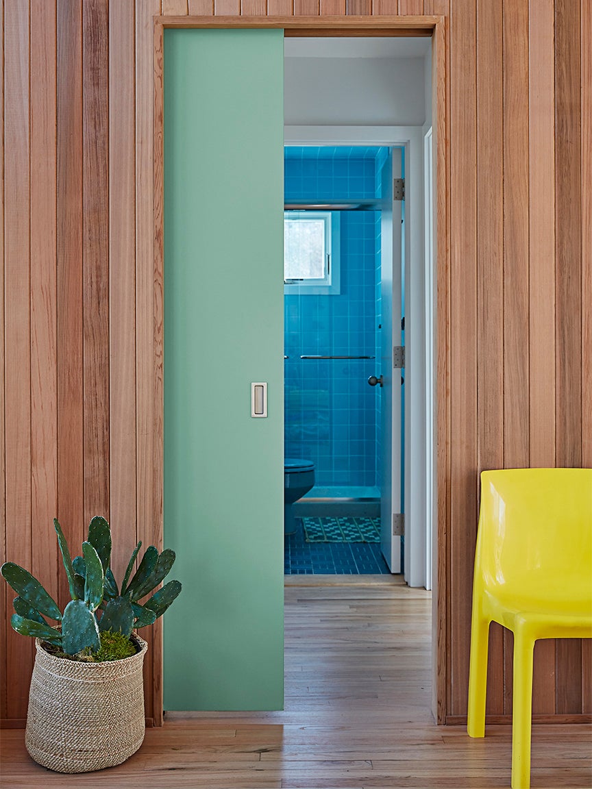 green door in wood hallway
