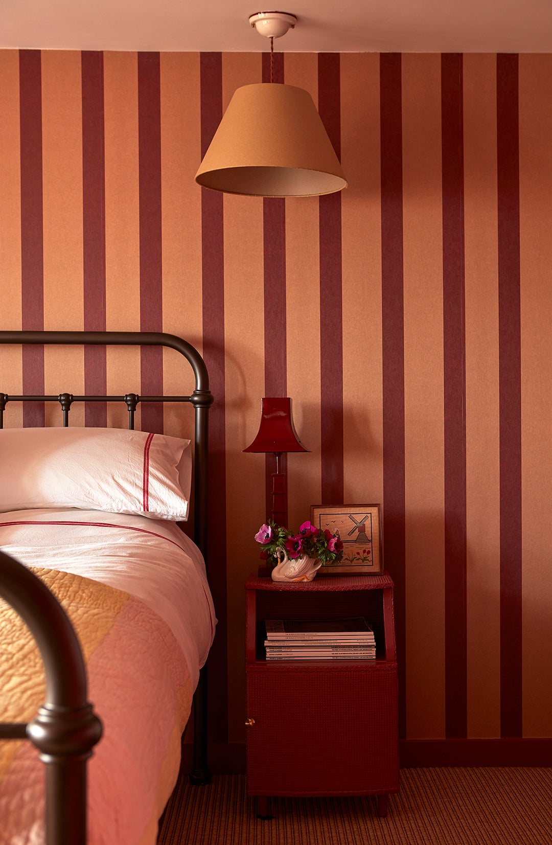 bedroom with orange and red striped walls