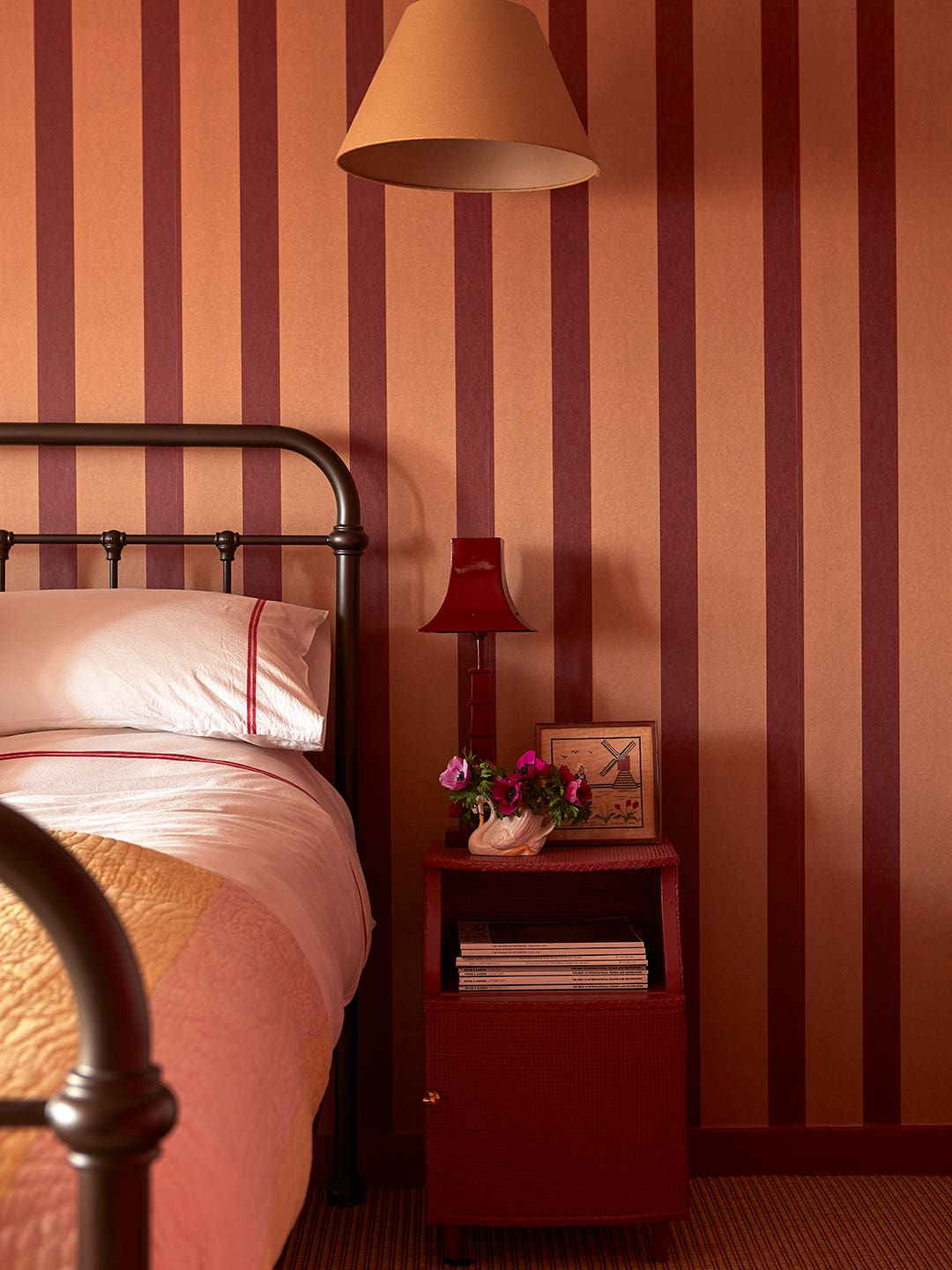 bedroom with orange and red striped walls