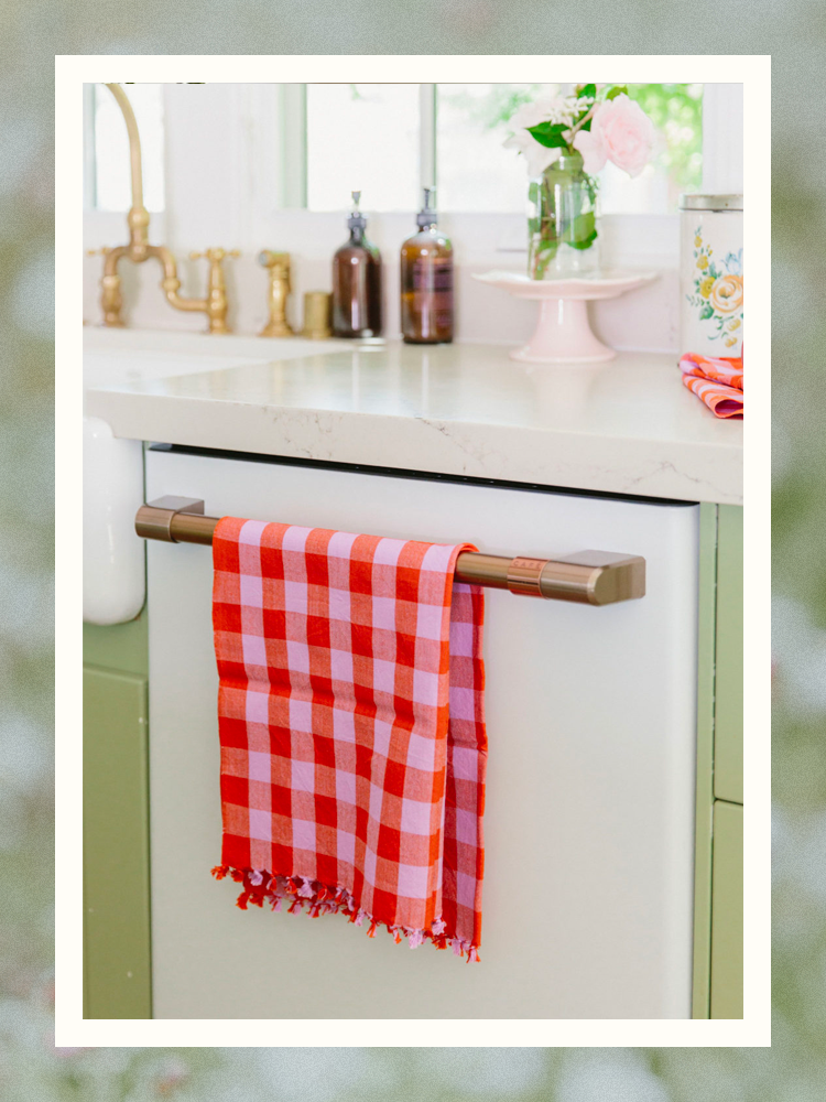 red gingham tea towel on dishwasher