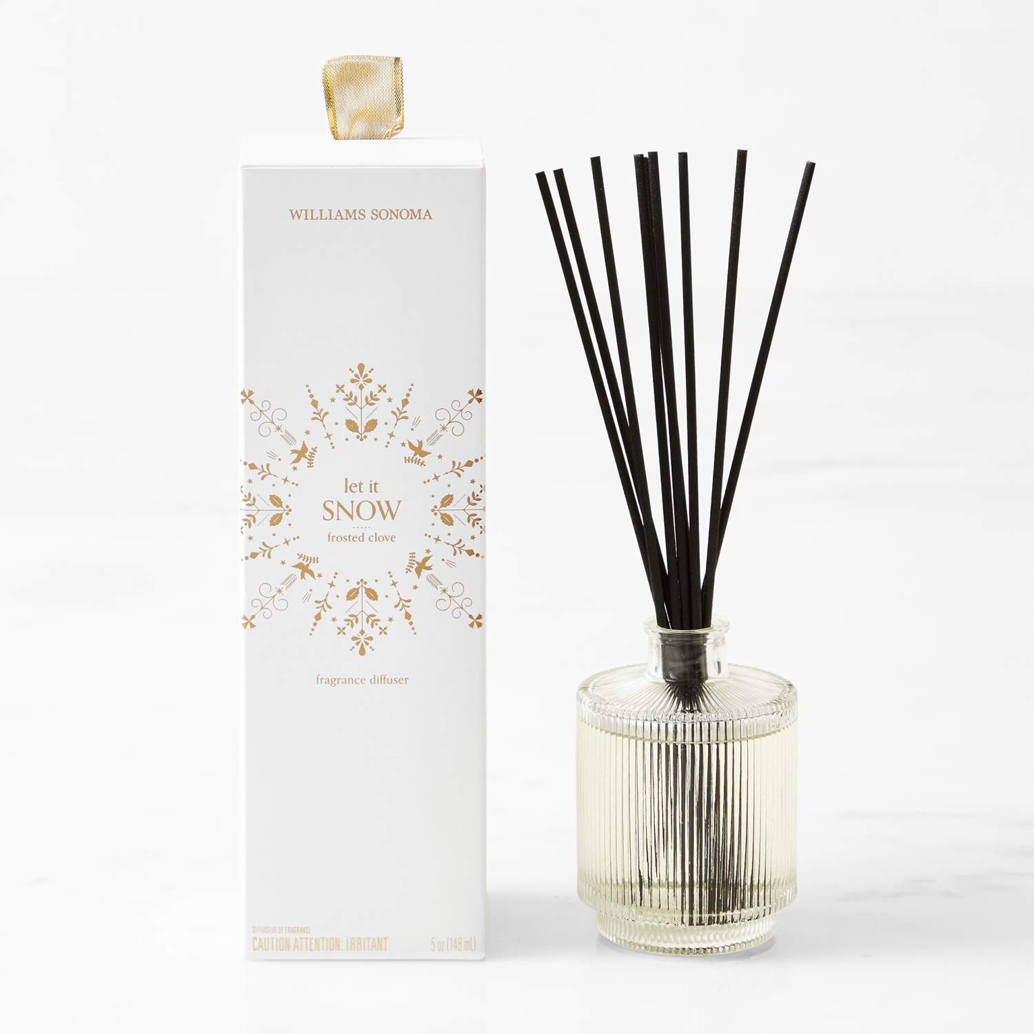 Faceted Reed Diffuser by Williams-Sonoma Next to White Box Package with Snow Decal