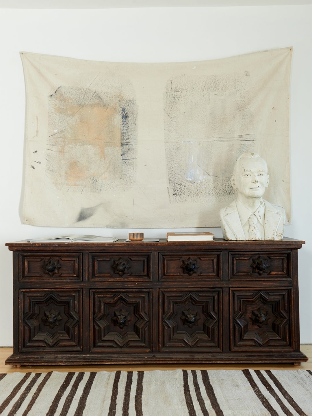 wooden credenza with marble bust