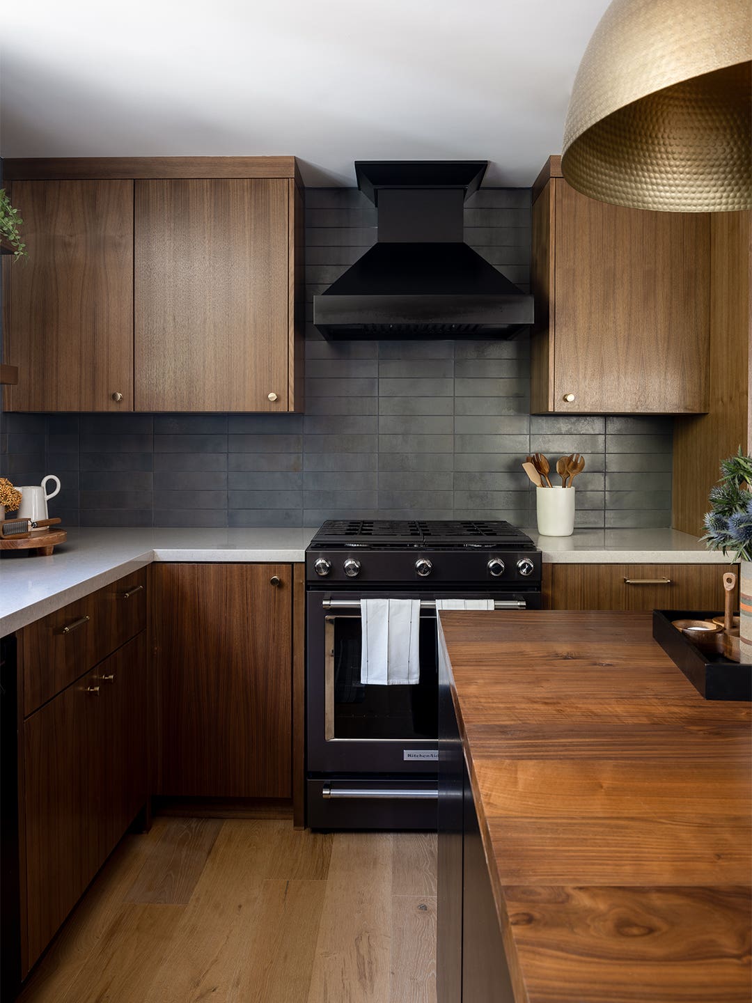 Kitchen with dark walls and wood cabinets