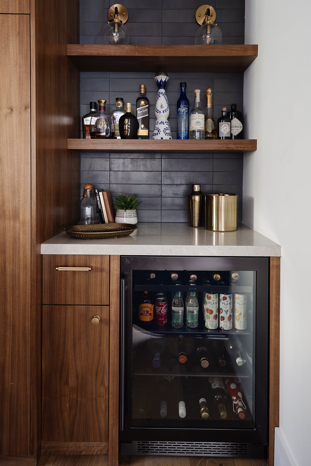 Bar with mini fridge and tiled wall