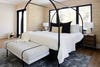 Canopy bed with white bedding