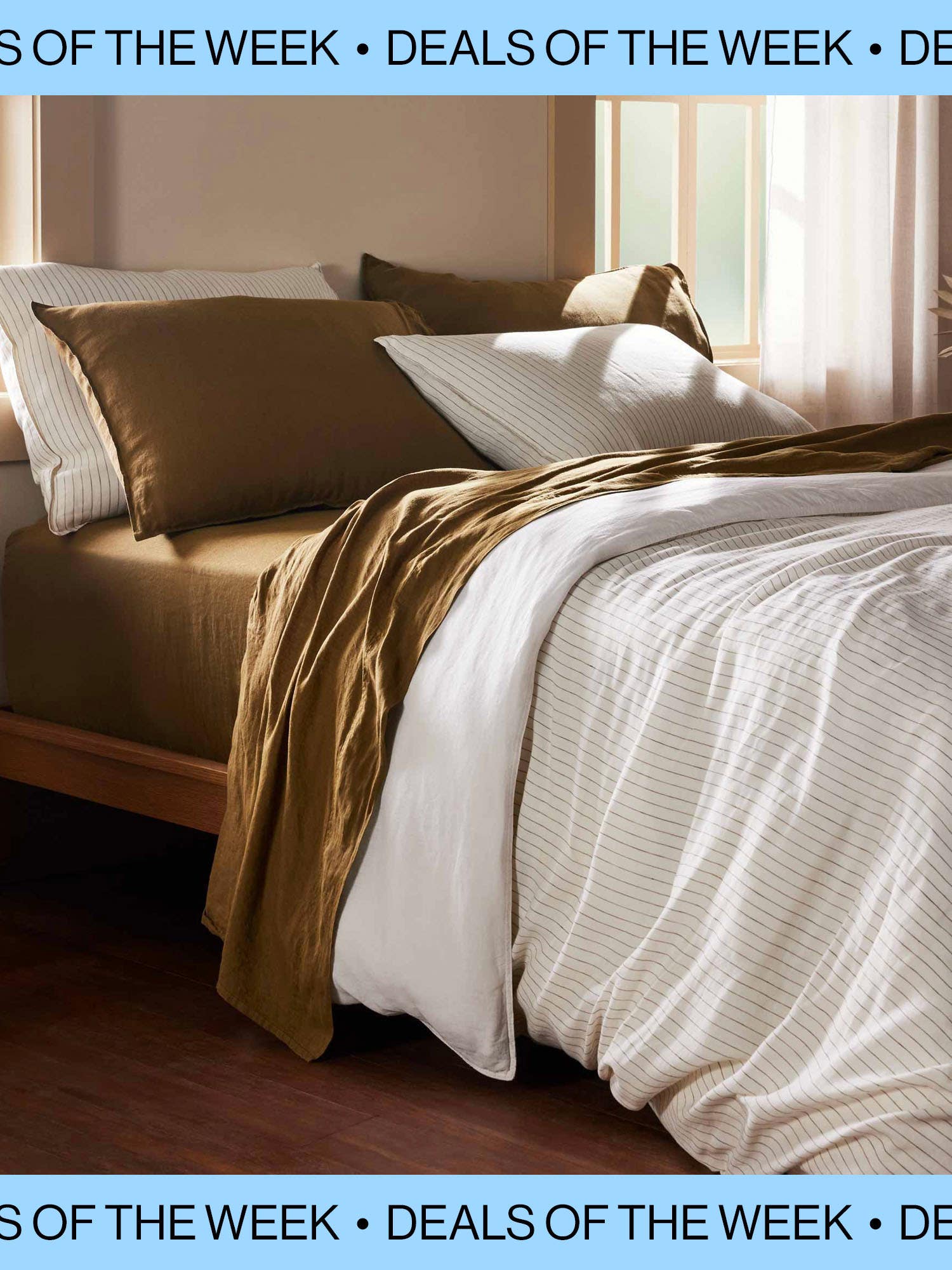 Bed with Brooklinen duvet and sheets on wooden bed frame