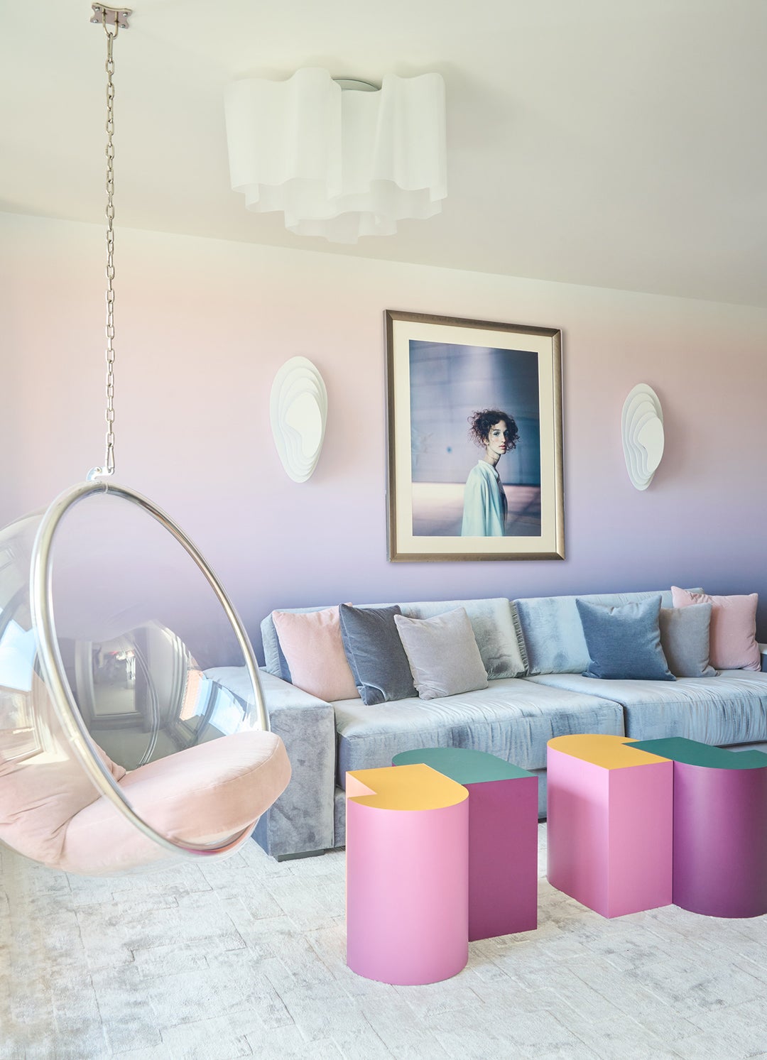 pink and purple gradient wallpaper with grey-blue sectional