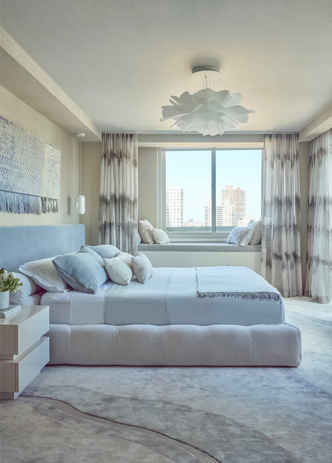 bedroom with white upholstered bed
