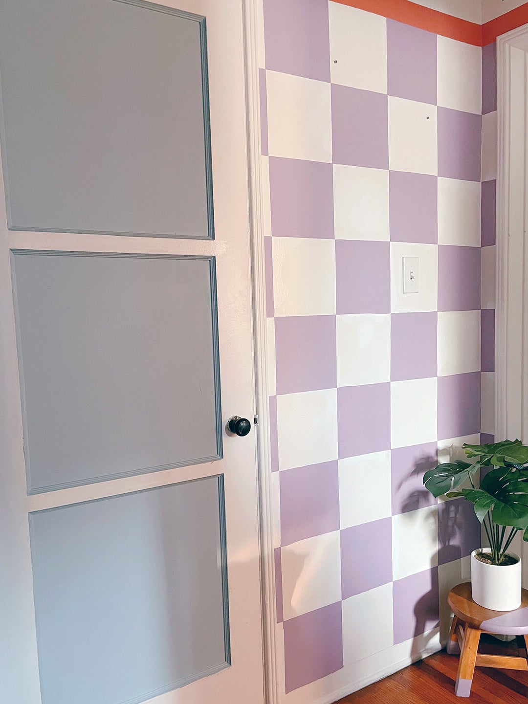An $8 Home Depot Buy Was Pivotal to This Lopsided Hallway’s Checkered Mural