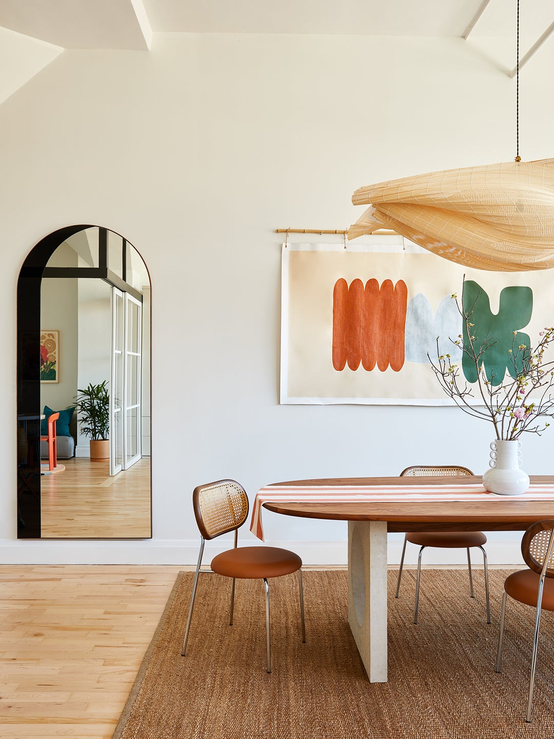 bright loft dining room with wood pendant