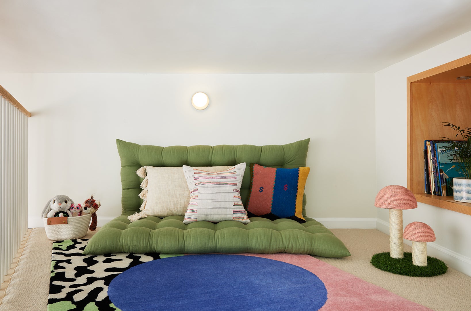children's loft space with green floor cushion