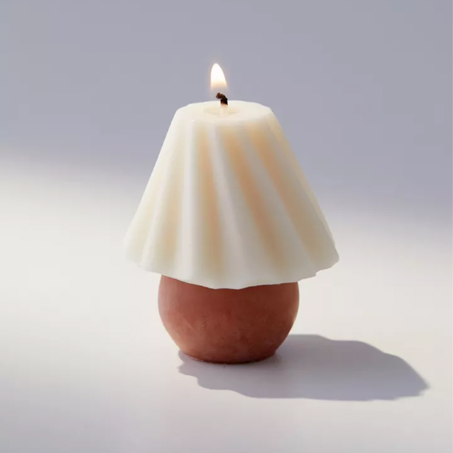 pleated lampshade looking small candle