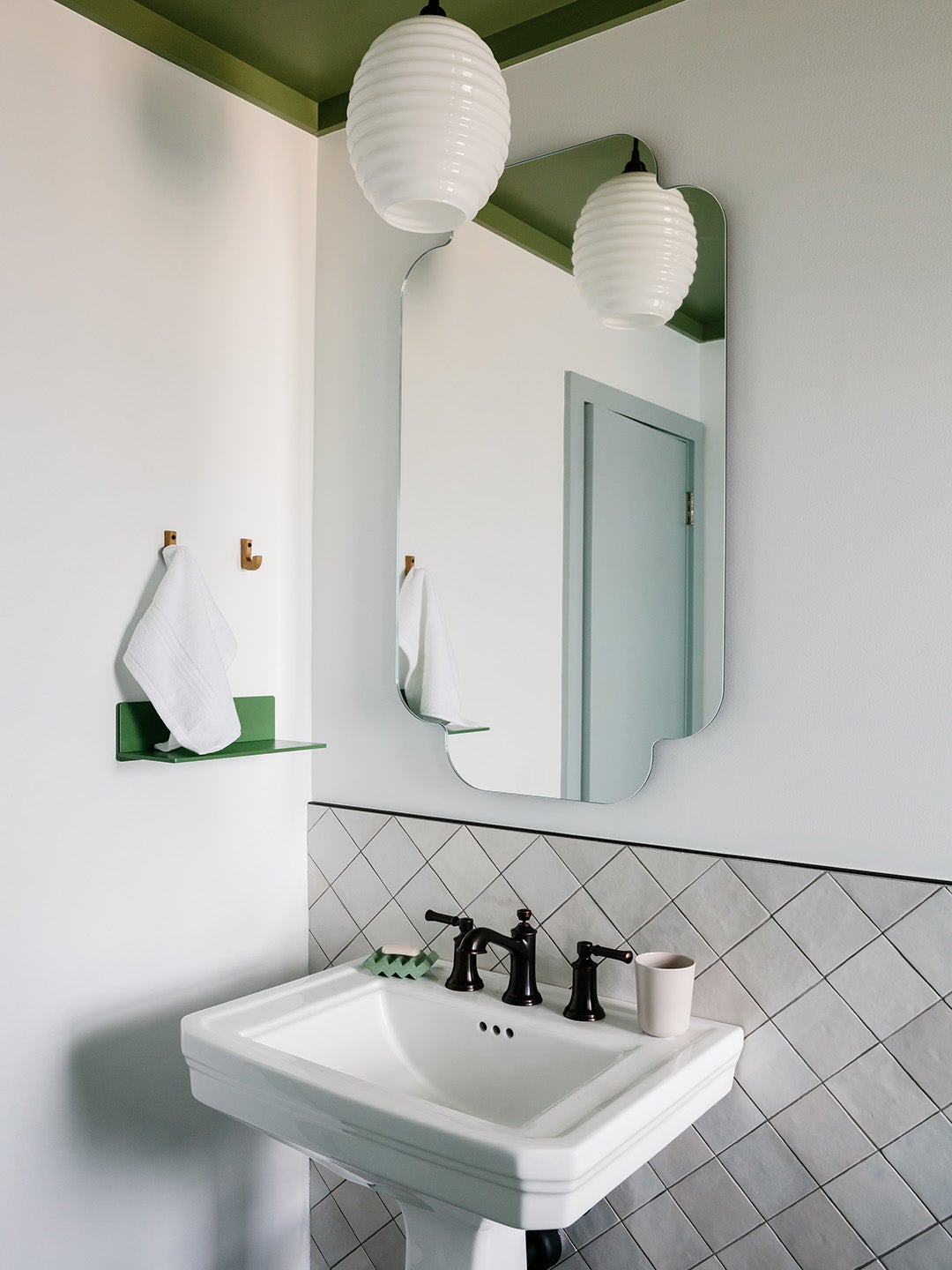 Bright white bathroom with green ceiling