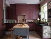 oxblood red kitchen with gray work table