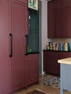 tall oxblood red kitchen cabinets