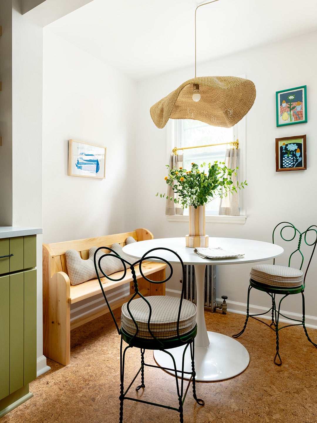 breakfast nook with wood bench and metal chairs