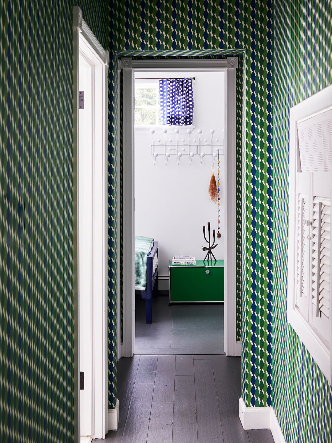 hallway with geometric green wallpaper