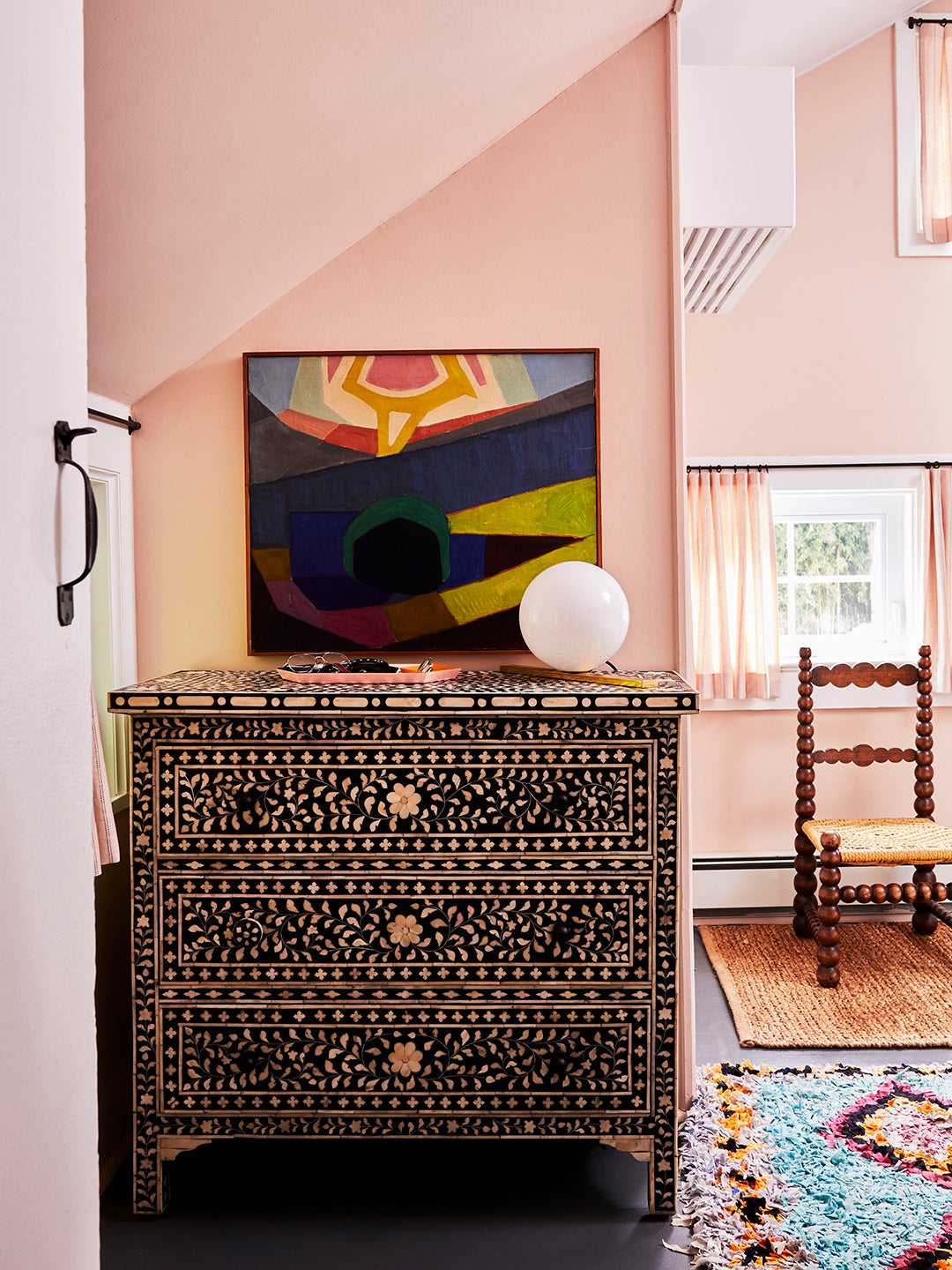 inlay dresser with abstract art above