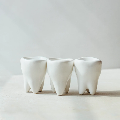 Three tooth-shaped shot glasses