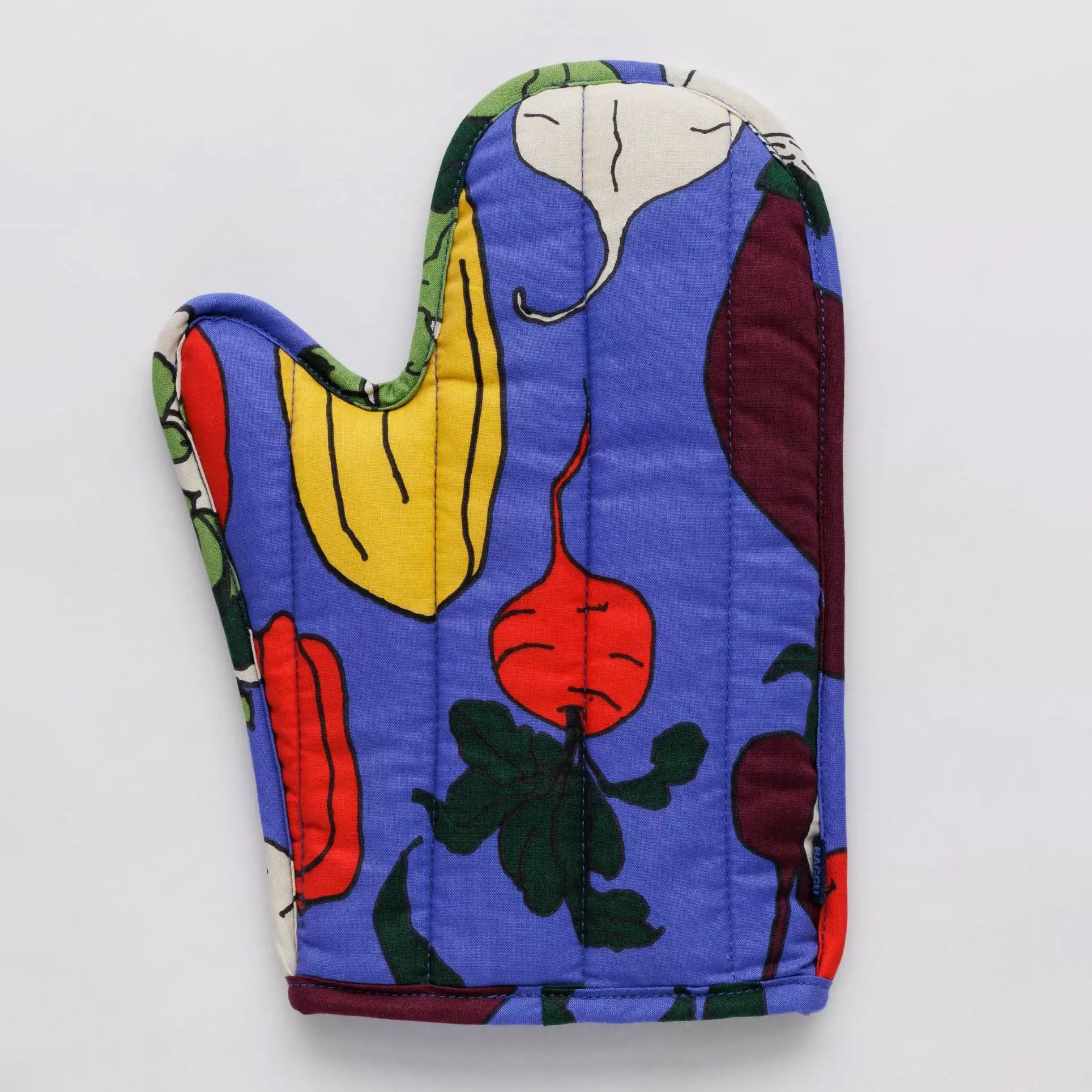 Periwinkle oven mitt with a print of colorful vegetable roots on a white surface.