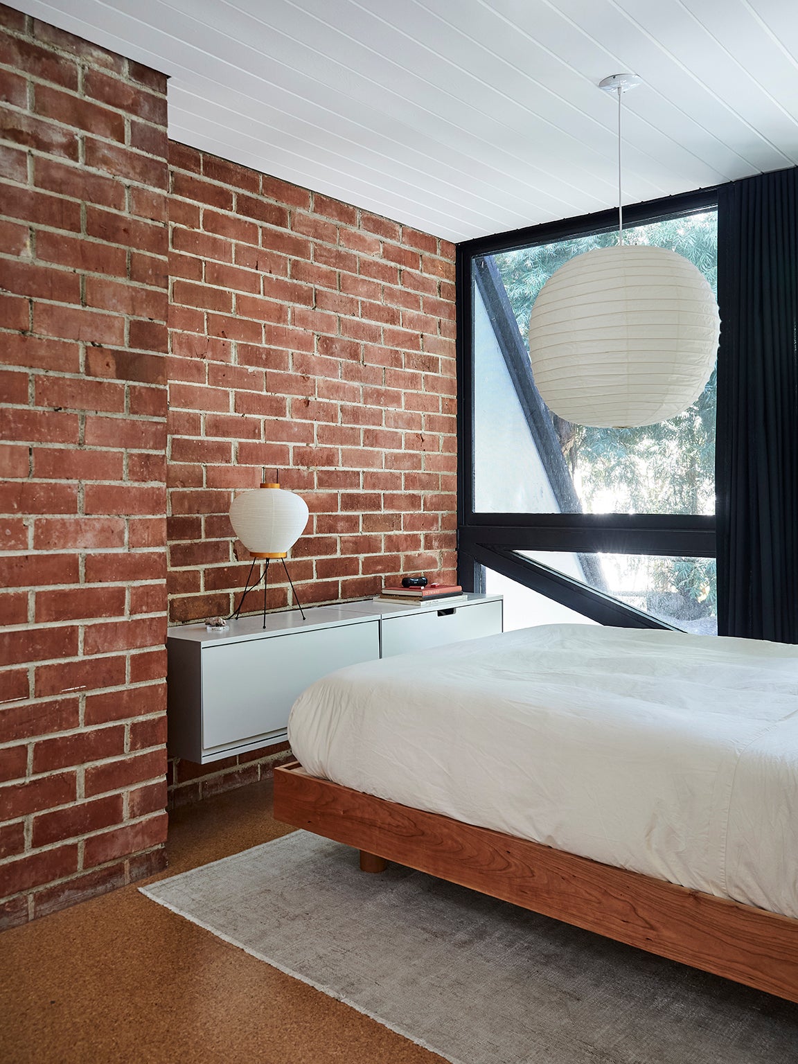 exposed brick wall with minimalist dresser