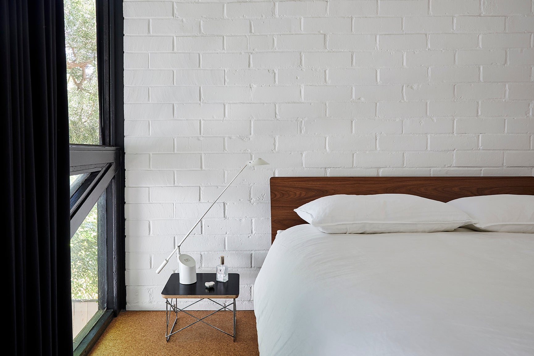 minimalist bedroom with white paneled walls
