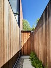 wood paneled walled walkway