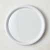 White dinner plate against a white background.