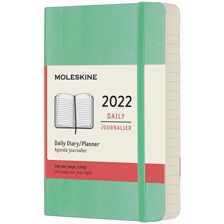 Mint moleskin daily planner against a white background.