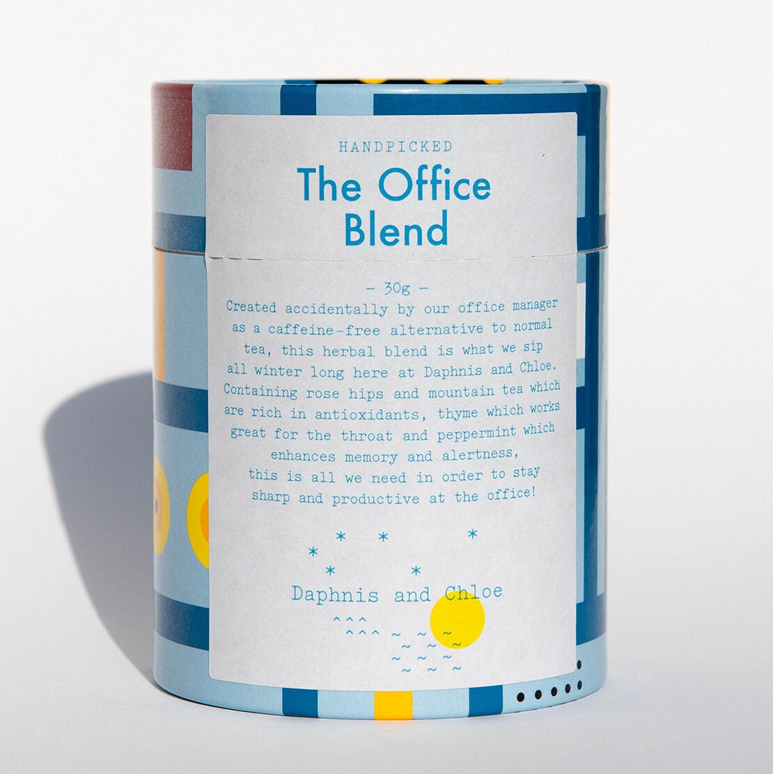 Caffeine free herbal blend packaged in a light blue cylinder case against a white background.