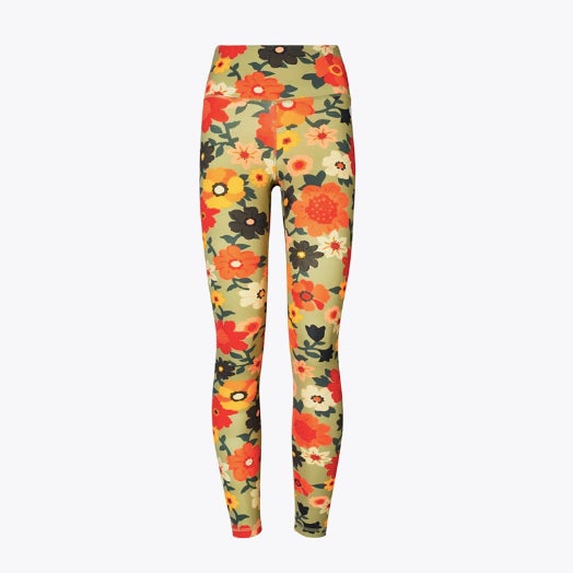 Tory burch sage green floral leggings against a white background.