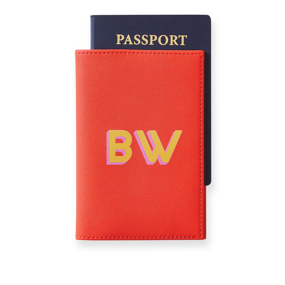 Bright coral vegan leather passport case.