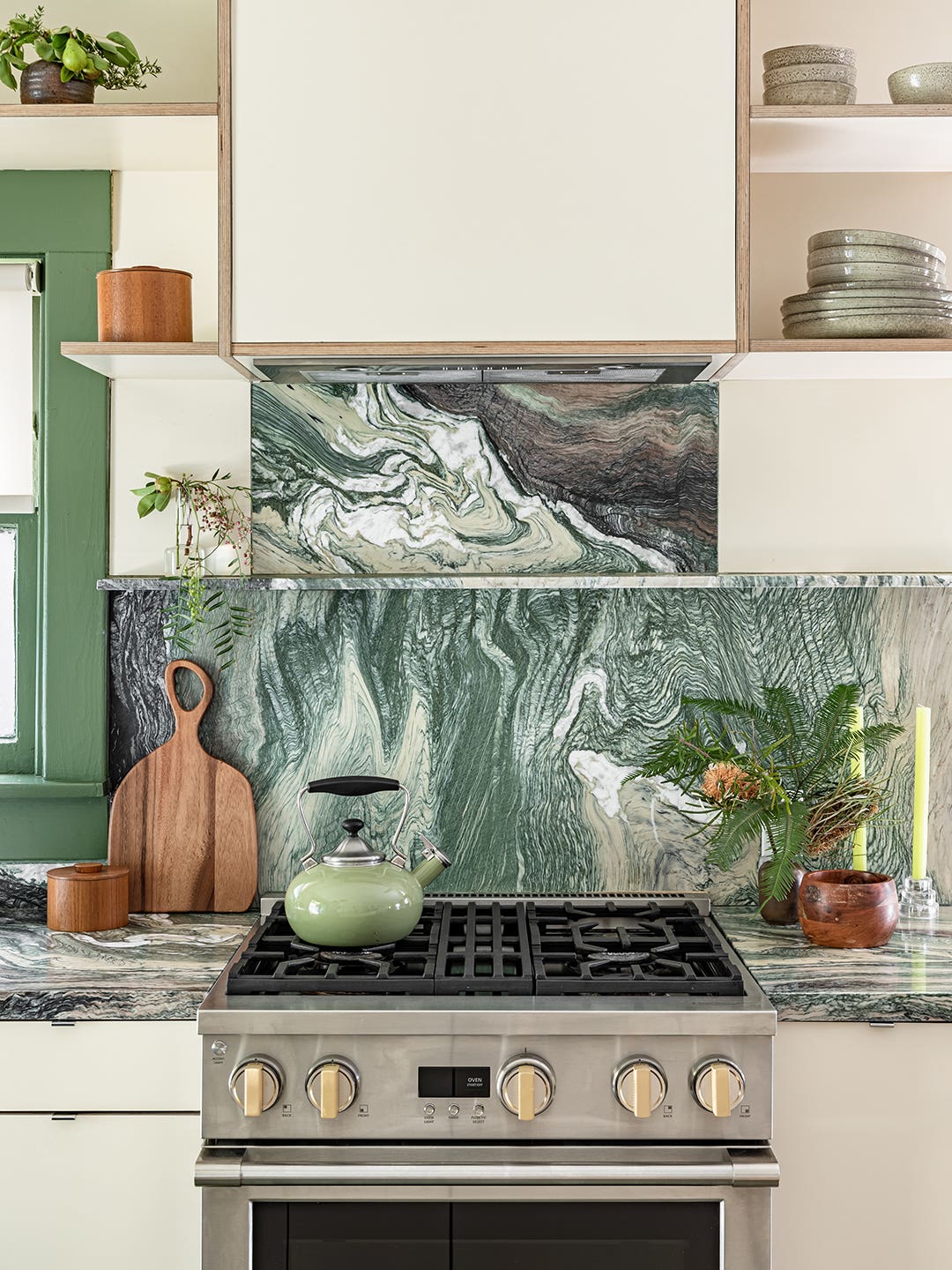Kitchen stove with green marble backsplash