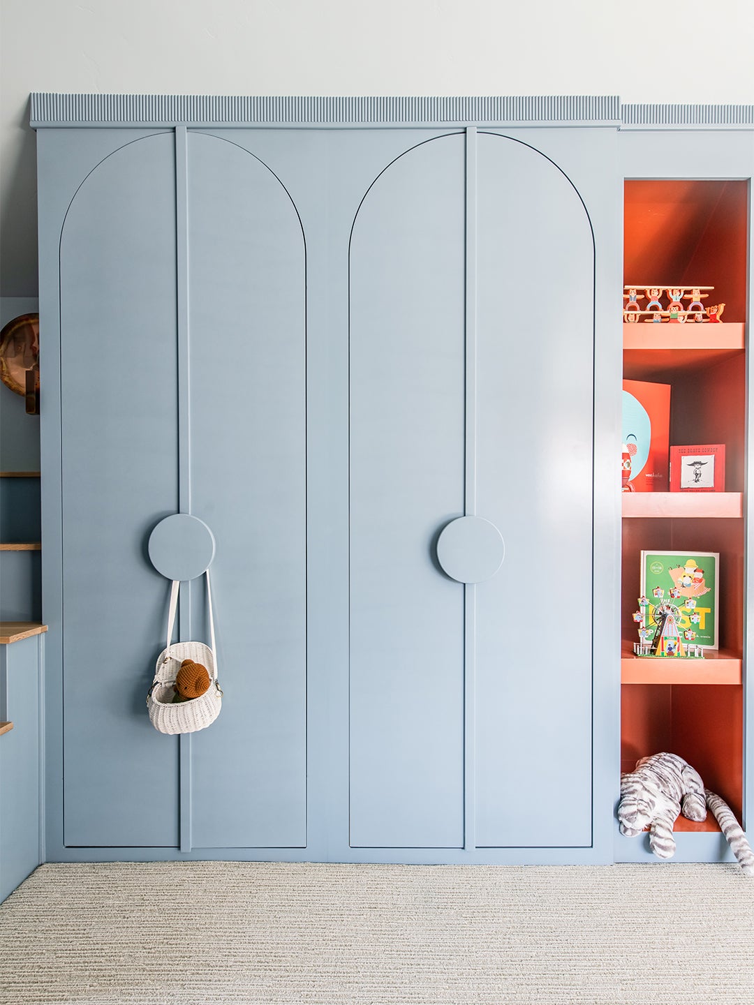 built-in arched storage and open shelves