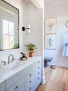 neutral bathroom with lily paintings