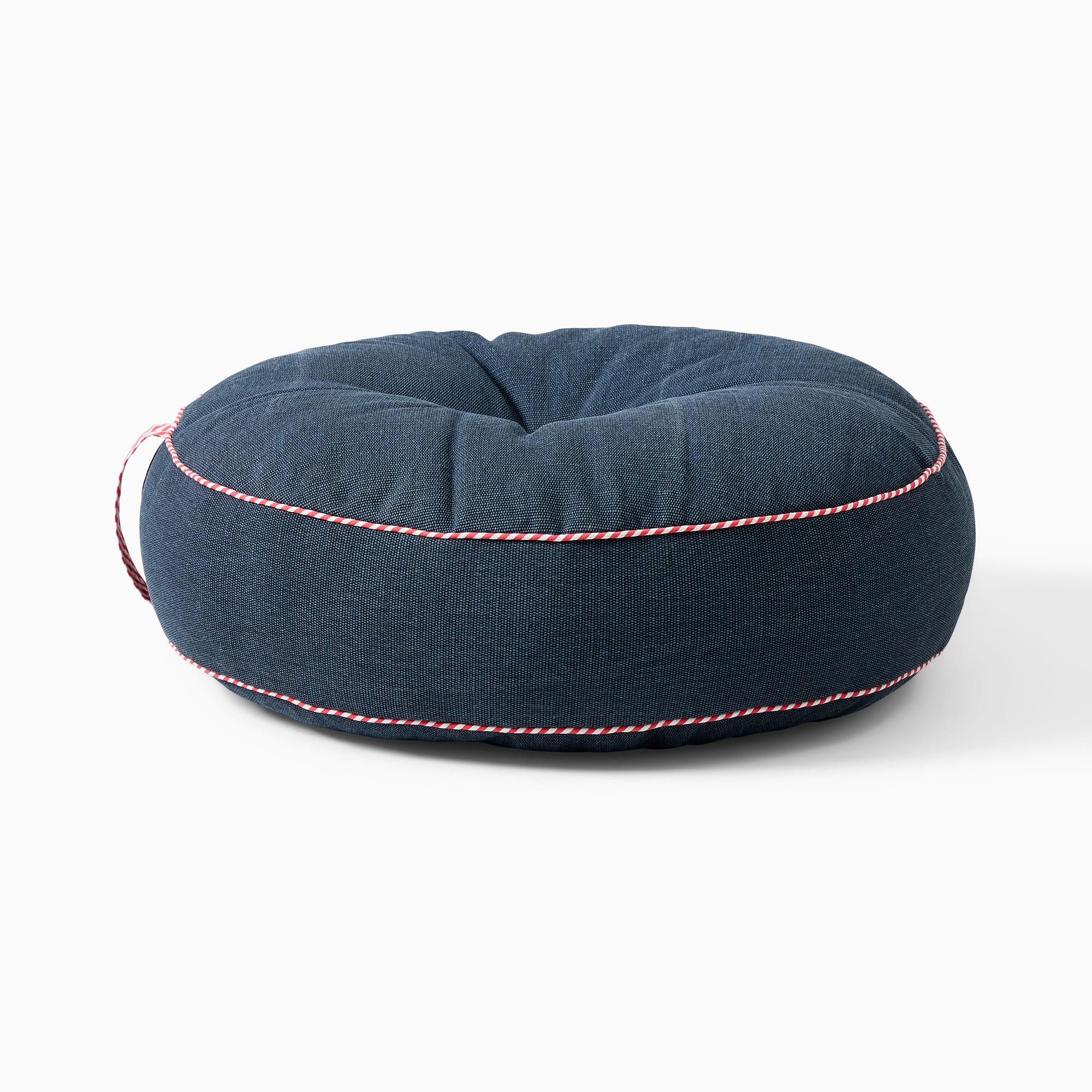 Navy round floor pillow with red and white striped borders.