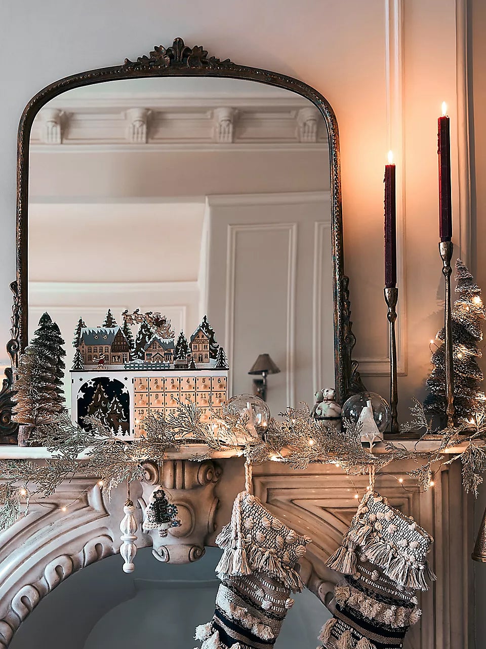 Mirror on a mantel with candlesticks