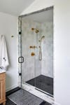 marble-trimmed shower stall