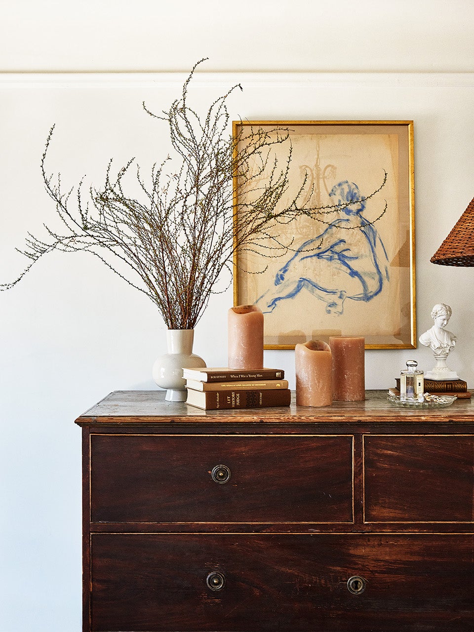 Dresser with branches in a vase